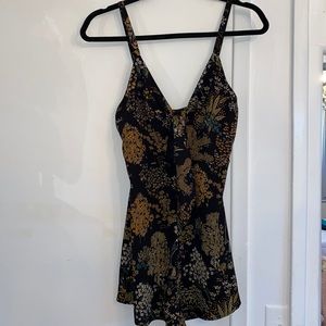 Black romper with floral patterns